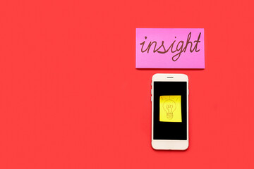 Sticky paper with drawn light bulb, mobile phone and word INSIGHT on red background