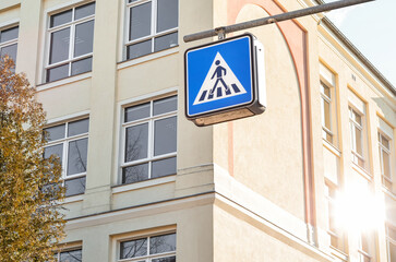 Pedestrian crossing sign in city