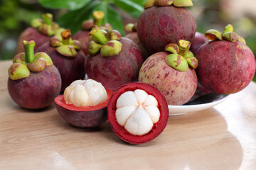 Mangosteen fruit, ripe, cut off the peel, white inner flesh Mangosteen is Asia's queen of fruits. Good for health.