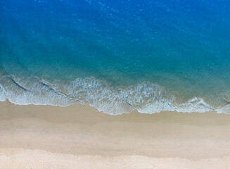 Fototapeta na wymiar Aerial view with beach in wave of turquoise sea water shot, Top view of beautiful white sand background