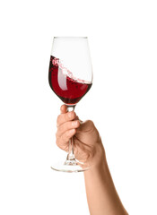 Female hand holding glass of red wine isolated on white background