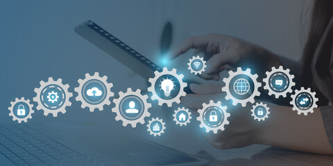 Fototapeta premium Woman touching icon technology screen displaying modern web system. 