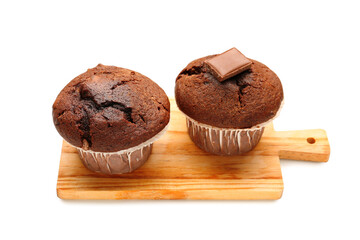 Wooden board with tasty chocolate cupcakes isolated on white background