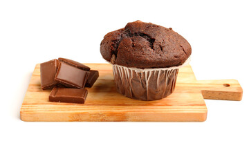Wooden board with tasty chocolate cupcakes isolated on white background