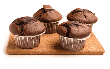 Board with tasty chocolate cupcakes isolated on white background