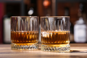 Glasses of cold rum on table in bar