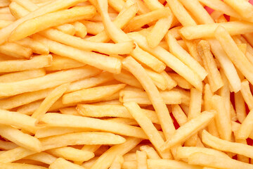Tasty french fries as background