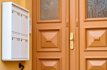 View of mailbox near door in city, closeup