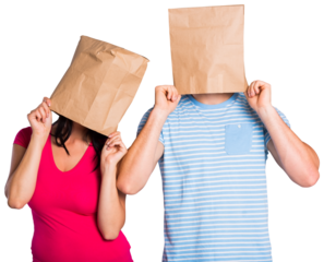 Young couple with bags over heads