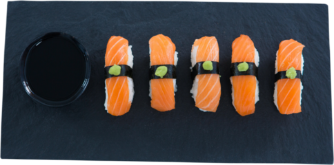 Close up of sushi served with sauce in bowl