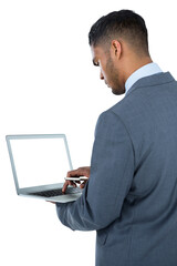 Focused businessman using laptop