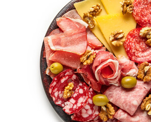 Plate with assortment of tasty deli meats and cheese isolated on white background, closeup