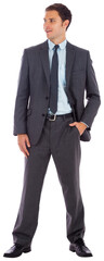 Happy businessman with hand in pocket