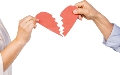 Cropped hands of couple holding broken heart