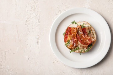 Tasty bacon bruschetta with arugula on white table