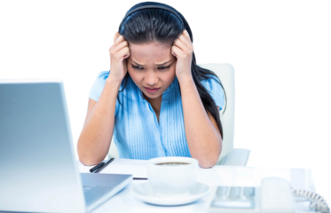 Stressed businesswoman working at her desk