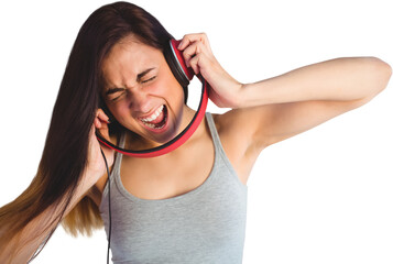 Woman shouting while listening music through headphones