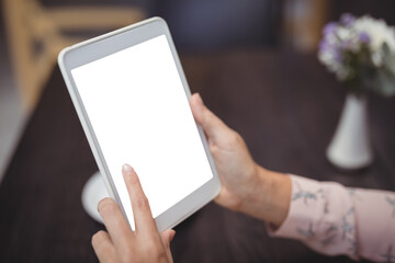 Close-up of woman hands using digital tablet