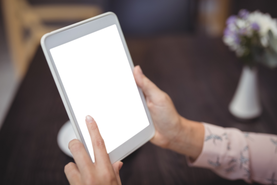 Close-up of woman hands using digital tablet