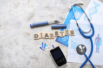 Word DIABETES with medical supplies on grunge background