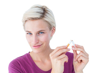 Pretty blonde breaking cigarette