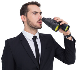 Surprised businessman standing and holding binoculars 