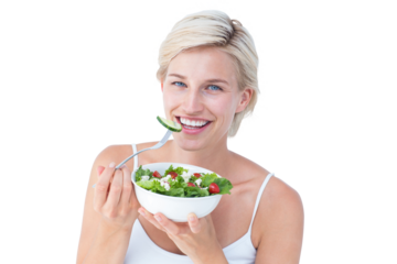 Beautiful blonde woman eating salad