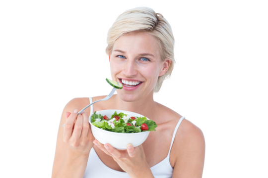 Beautiful blonde woman eating salad