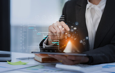 Technology and financial advisory services concert. Business woman working on digital tablet and laptop computer with advisor showing plan of investment to clients at table office. Digital marketing.