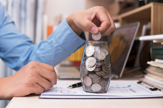 Fill the glass bottle with coins and continue placing coins
