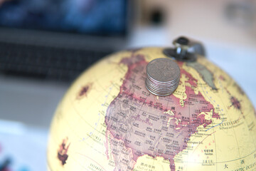 The coin is on the globe