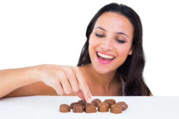 Pretty brunette picking out chocolate