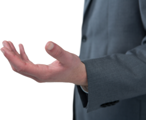 Midsection of businessman holding invisible object against white background