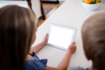 Children using digital tablet