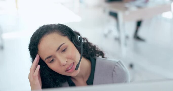 Business woman, call center and headache in frustration consulting in customer service or support at office. Tired and annoyed female consultant or agent talking to difficult client for online advice