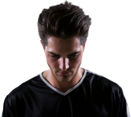Upset football player looking down
