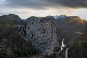 view of the Notre Dame du Roc Chapel on its clifftop promontory above Castellane village in the upper Verdon Gorge