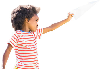 Playful boy playing with paper airplane