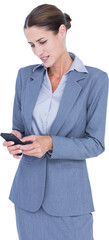Irritated businesswoman using mobile phone
