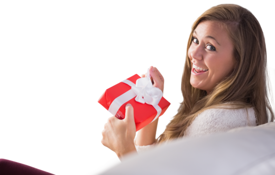 Pretty blonde relaxing on the couch with gift