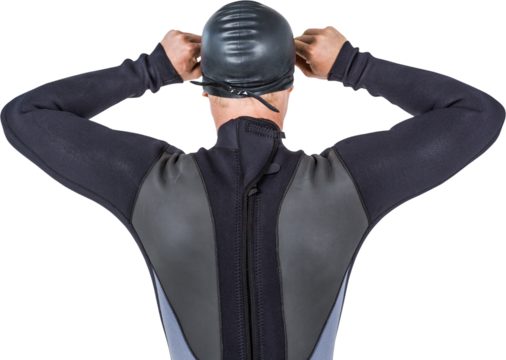 Rear view of swimmer in wetsuit wearing swimming goggles - Powered by Adobe