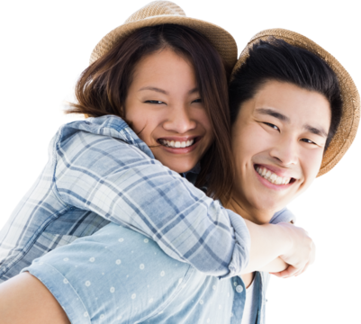 Portrait of happy man giving piggyback ride to woman