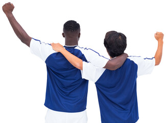 Rear view of two football players rejoicing