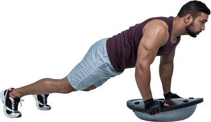 Muscular man doing bosu push ups