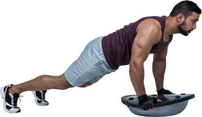 Muscular man doing bosu push ups