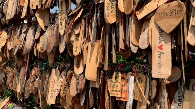 hand-written wooden art in different shapes and sizes filled with love notes, love letters, motivational, and inspirational.