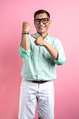 Man with eyeglasses and a shirt showing a rainbow bracelet