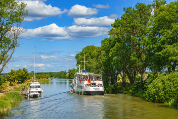 Beautiful view on Gota canal in Sweden with boats and holiday makers