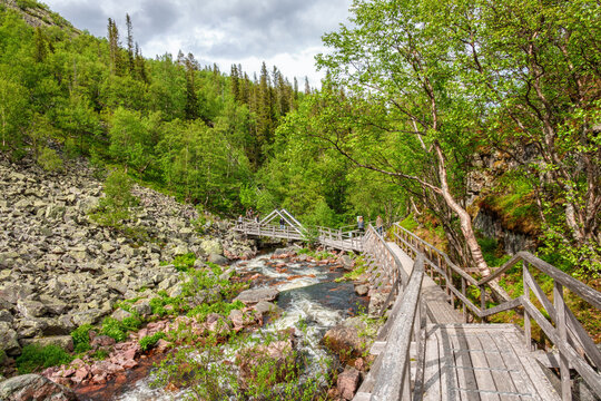 Hiking trail along a river in a ravine