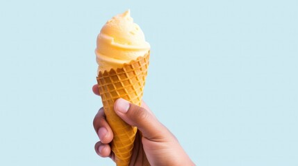 Hand holding yellow mango ice cream with cone isolated on pastel background, copy space. Generative AI. - obrazy, fototapety, plakaty